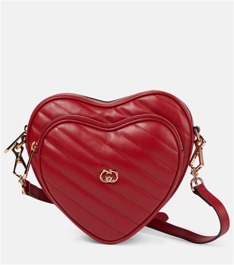 gucci black bag with red hearts|Gucci interlocking shoulder bag.